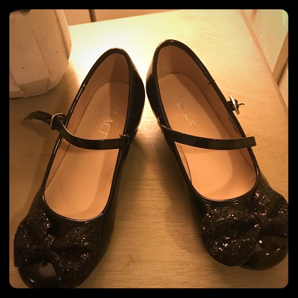 Black Dress shoes with Short Heels and Bows.